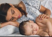 A Woman Sleep with her child On his bed