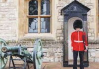 An old porter who was guarding the main gate of the palace in old and fine uniform